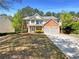 Charming two-story home with brick accents, a well-maintained lawn, and a two-car garage in a desirable neighborhood at 956 Buckhorn Bnd, Locust Grove, GA 30248