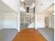 Spacious foyer with hardwood floors, a staircase, and lots of natural light at 956 Buckhorn Bnd, Locust Grove, GA 30248