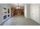 Bright and airy kitchen adjacent to living space, offering stainless steel appliances and access to outdoor patio at 956 Buckhorn Bnd, Locust Grove, GA 30248