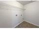 Simple laundry room with washer and dryer hookups and practical flooring at 956 Buckhorn Bnd, Locust Grove, GA 30248