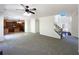 Open-concept living room with kitchen access and natural light from the foyer at 956 Buckhorn Bnd, Locust Grove, GA 30248