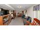 Spacious carpeted basement featuring a piano, entertainment center, and a comfortable seating area at 3560 Riverchase Dr, Decatur, GA 30034