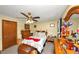 This is a small bedroom with standard ceiling fan, carpet and decor at 3560 Riverchase Dr, Decatur, GA 30034
