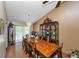 Spacious dining room with a long wooden table, seating for ten, and a glass-front china cabinet at 3560 Riverchase Dr, Decatur, GA 30034