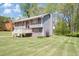 Charming home with a well-maintained lawn, featuring a cozy front porch and attached garage at 3560 Riverchase Dr, Decatur, GA 30034