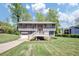 Charming two-story home with a well-manicured lawn and inviting front deck at 3560 Riverchase Dr, Decatur, GA 30034