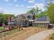 Expansive property with a lush garden, outdoor pizza oven, patio, and charming garden shed at 1102 Emory St, Oxford, GA 30054