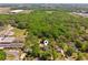 Aerial view of home and neighborhood with mature trees at 1102 Emory St, Oxford, GA 30054