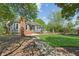 Charming home featuring an inviting outdoor patio and walkway leading to a lush green lawn at 1102 Emory St, Oxford, GA 30054
