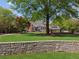 Landscaped backyard offering a serene view of the home and outdoor living spaces at 1102 Emory St, Oxford, GA 30054