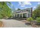 Inviting two-story home featuring a columned front porch and a circular driveway at 1102 Emory St, Oxford, GA 30054