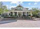 Charming two-story home with a columned front porch and meticulously landscaped front yard at 1102 Emory St, Oxford, GA 30054
