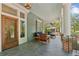 Spacious porch with outdoor seating, slate floors, and classic columns at 1102 Emory St, Oxford, GA 30054