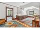 Upstairs hallway featuring detailed wood trim, staircase, and wood floors at 1102 Emory St, Oxford, GA 30054