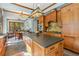 Open-concept kitchen with ample counter space, stainless steel appliances, and hardwood cabinets at 1102 Emory St, Oxford, GA 30054
