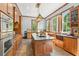 Gourmet kitchen featuring granite countertops, stainless steel appliances, and custom cabinetry at 1102 Emory St, Oxford, GA 30054