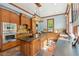 Well-appointed kitchen with a center island, custom cabinets, and stone countertops at 1102 Emory St, Oxford, GA 30054