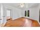 Bright bedroom with hardwood floors and access to a second room at 1685 Carroll Nw Dr, Atlanta, GA 30318