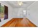 Bright bedroom with hardwood floors and adjoining bathroom at 1685 Carroll Nw Dr, Atlanta, GA 30318