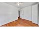 Bedroom with hardwood floors, white walls, and closet at 1685 Carroll Nw Dr, Atlanta, GA 30318