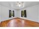 Spacious bedroom with hardwood floors and sunlit windows at 1685 Carroll Nw Dr, Atlanta, GA 30318