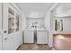 Well lit laundry room with washer and dryer, window, and doorway to other rooms at 1685 Carroll Nw Dr, Atlanta, GA 30318