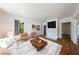 Bright living room with a fireplace, hardwood floors and stylish decor at 1685 Carroll Nw Dr, Atlanta, GA 30318