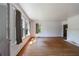Spacious living room with fireplace, hardwood floors, and natural light at 1685 Carroll Nw Dr, Atlanta, GA 30318