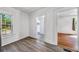 Bright living room features wood floors, white trim, and a window view at 1685 Carroll Nw Dr, Atlanta, GA 30318