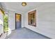 Covered porch with a wooden door and a view of the outdoors at 1685 Carroll Nw Dr, Atlanta, GA 30318
