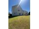 Large backyard with vinyl siding and a well-maintained lawn at 2763 Storybook Ct, Grayson, GA 30017