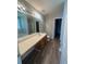 Spacious bathroom with double vanity, tile floors, and separate toilet area at 2763 Storybook Ct, Grayson, GA 30017