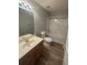 Full bathroom with shower-tub combo, vanity with sink, toilet, and neutral gray walls at 2763 Storybook Ct, Grayson, GA 30017