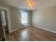 Cozy bedroom space with wood flooring, a window, and gray walls is awaiting its new owner at 2763 Storybook Ct, Grayson, GA 30017