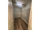 Walk-in closet with wire shelving and wood-style flooring at 2763 Storybook Ct, Grayson, GA 30017
