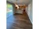 Bright dining area featuring hardwood floors, and view to a modern kitchen with stainless steel appliances at 2763 Storybook Ct, Grayson, GA 30017
