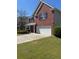 Charming brick home featuring a two-car garage and nicely maintained front yard at 2763 Storybook Ct, Grayson, GA 30017