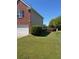Two-story brick home with a well-manicured lawn and attached garage at 2763 Storybook Ct, Grayson, GA 30017