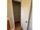 This is a walk-in pantry with white shelving and wood floors for easy organization at 2763 Storybook Ct, Grayson, GA 30017
