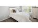 Bedroom features a comfortable bed, a window for natural light, and neutral carpet at 2857 Regal Park # 3, Atlanta, GA 30318