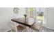 Bright dining area features a wood table, chairs, and natural light from the double doors at 2857 Regal Park # 3, Atlanta, GA 30318