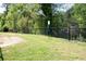 Fenced dog park with lush green grass and trees offers a safe and enjoyable space for pets to exercise at 2857 Regal Park # 3, Atlanta, GA 30318
