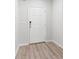 Bright entryway with wood-look flooring and white six-panel door at 2857 Regal Park # 3, Atlanta, GA 30318