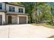 Stylish townhome exterior with attached garage, clean lines, and modern design at 2857 Regal Park # 3, Atlanta, GA 30318