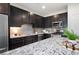 Beautiful kitchen with stainless appliances, granite countertops, and dark wood cabinets at 2857 Regal Park # 3, Atlanta, GA 30318