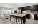 Modern kitchen with granite island, stainless steel appliances, and adjacent living area at 2857 Regal Park # 3, Atlanta, GA 30318