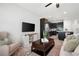 Inviting living room with a TV, a comfortable sofa and chair, and access to the kitchen at 2857 Regal Park # 3, Atlanta, GA 30318