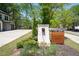 The Park at Monroe brick sign welcomes you to the neighborhood, surrounded by lush landscaping and mature trees at 2857 Regal Park # 3, Atlanta, GA 30318