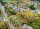 Property aerial shows the home's proximity to other houses in a leafy suburban setting at 3024 Bob Cox Rd, Marietta, GA 30064