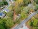 Aerial view of the home nestled among mature trees, conveniently located near a road at 3024 Bob Cox Rd, Marietta, GA 30064